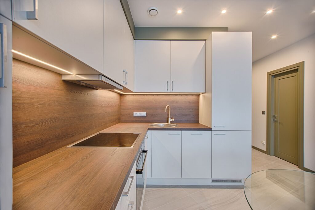 White & Teak Finish L Shaped Kitchen